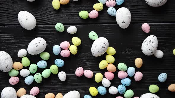Easter Holidays Concept. Colorful Different Kinds of Eggs Placed on Black Wood alt