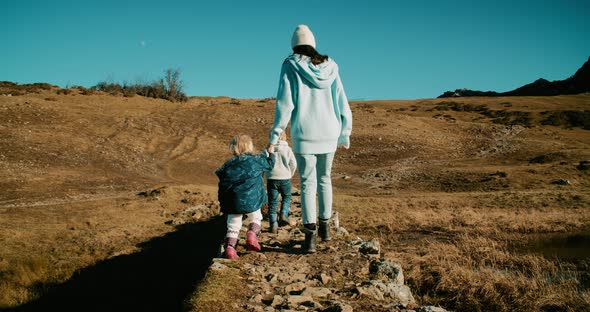 Family Travel Together Exploring World and Nature on Mountain Adventure alt