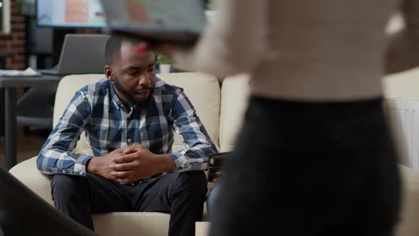 Group of Colleagues Analyzing Financial Statistics on Charts alt