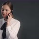Young Manager Woman in Business Suit Has a Business Talk Via Mobile Phone Work with Objections Sells