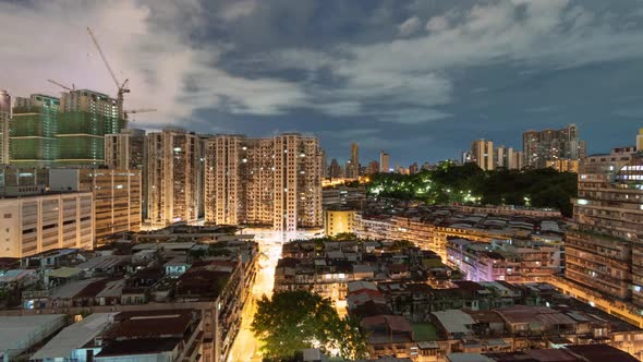 Night to day time lapse of Macau residential area, wide angle alt
