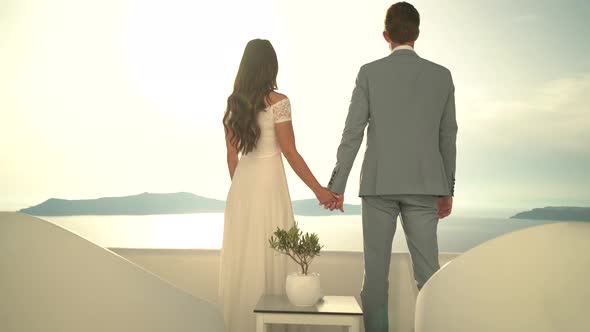 Wedding Couple on Luxury Terrace at Sunset