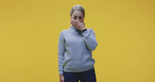 Woman Covering Her Eyes alt