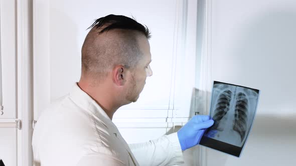 A Professional Doctor Makes A Diagnosis For A Patient. Medical Worker In The Room For Diagnostics alt