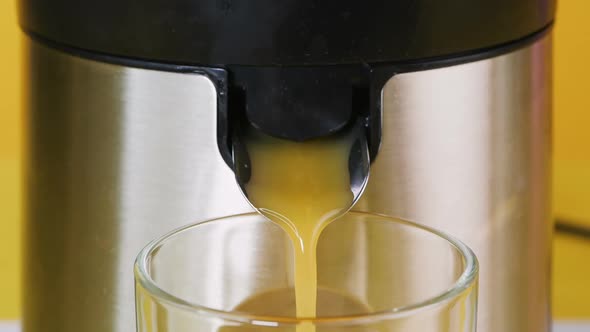 Fresh Juice Is Poured Into a Glass. Freshly Prepared Natural Drink, Juice. Close Up.