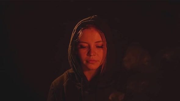 Girl Holding a Bowl of Fire alt