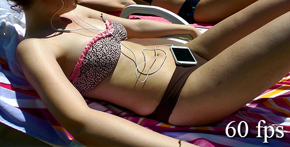 Bikini Girl Taking Sun Bath and Listening Music 2