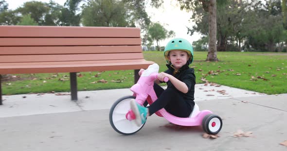 Tricycling Girl At Park