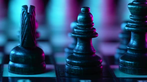 Board Intelligence Game  Wooden Chess Under Neon Colorful Light  Pink and Blue alt