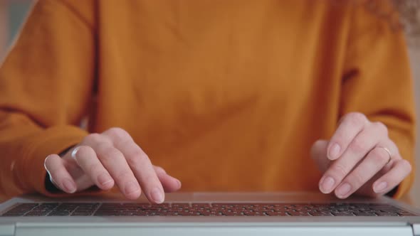 Woman Blogger Freelancer Working on Laptop Taping and Using Keypad