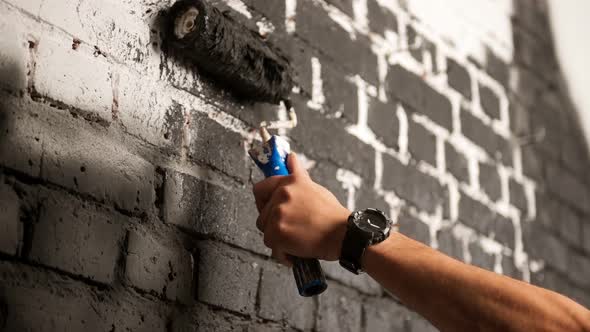 Close Up Shot of Black Paint Being Applied on a Wall