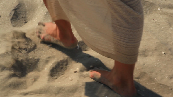 Footprints On The Beach Left Behind