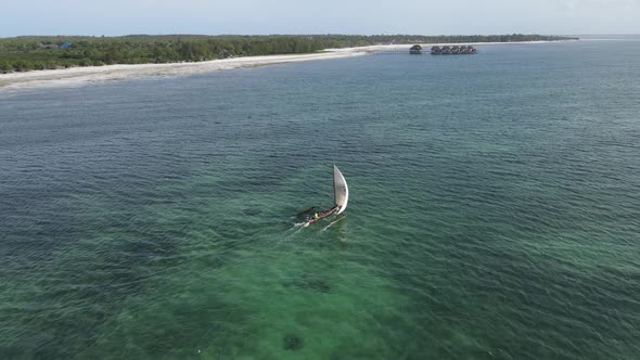 Aerial View of a Boat in the Ocean Near the Coast of Zanzibar Tanzania alt