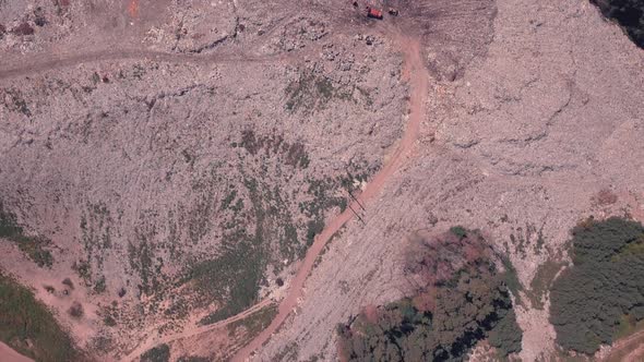 Top View of a Garbage Dump Where Machinery Equals Mountains of Household Waste, Ukraine. Ecological