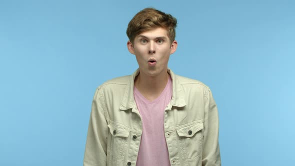 Slow Motion of Handsome Young Man Checking Out Cool Promo Offer Raising Eyebrows and Looking