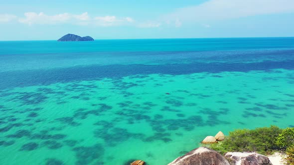 Wide aerial abstract view of a white sandy paradise beach and blue water background in hi res 4K alt