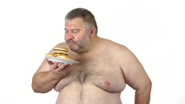 Fat Man Holding Plate with Burgers alt
