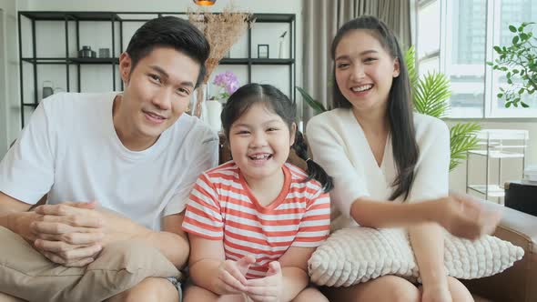 happiness asian family parent and daughter video call to grand parent good conversation alt