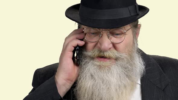 Old Bearded Man Talking on Cell Phone alt