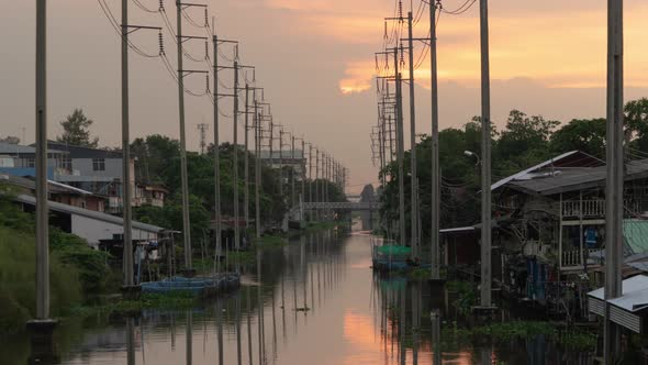 Time lapse of Utility poles tower and cable wires and Chao Phraya River alt