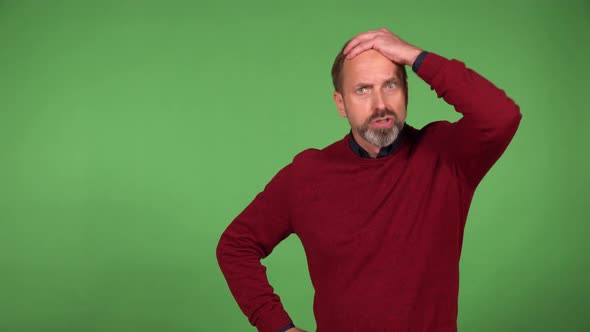 A Middleaged Handsome Caucasian Man is Angry and Shouts at the Camera  Green Screen Background