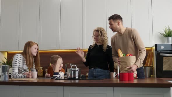 Positive Deaf Family with Kids Meeting in Kitchen alt