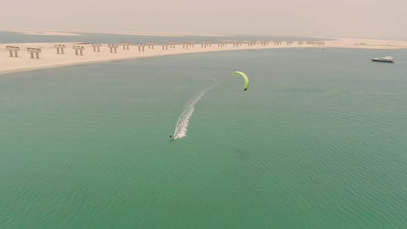 Aerial view of people practicing windsurfing at Jumeirah beach, U.A.E. alt