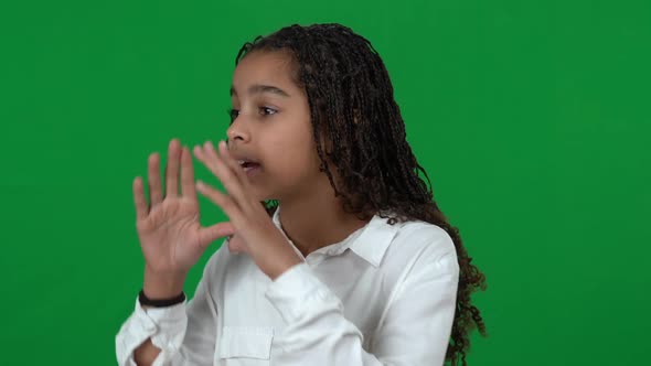 Closeup of Stressed Lost African American Teen Girl Shouting Calling for Help at Chromakey alt
