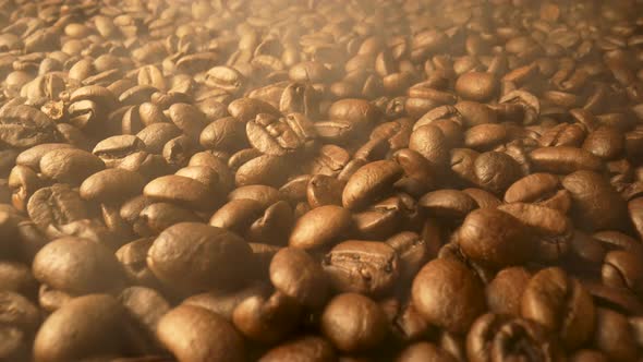 Brown Coffee Beans with Outgoing Aromatic Steam After Roasting alt