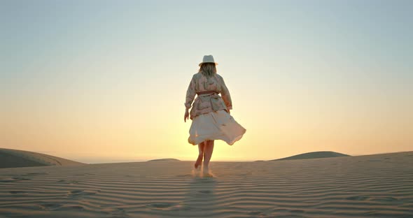Woman Running Toward the Sunset By Scenic Desert Nature Landscape  Slow Motion alt