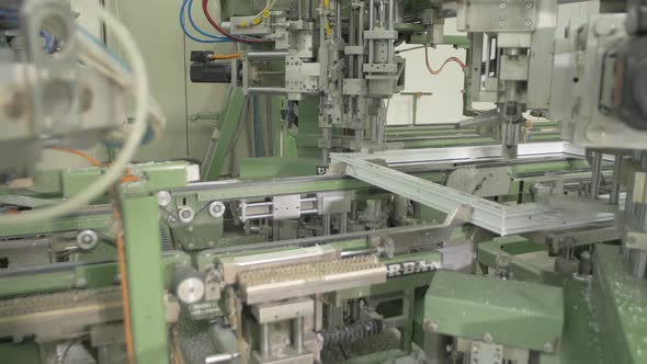 Machinery inside a window factory alt