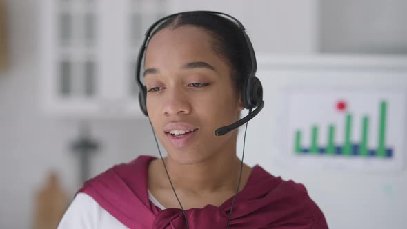 Headshot of Bored Dissatisfied Young Woman in Headphones Sighing Talking Looking at Camera alt
