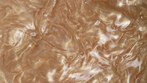 Super Slow Motion Shot of Pearl Glittering Liquid Background at 1000Fps alt