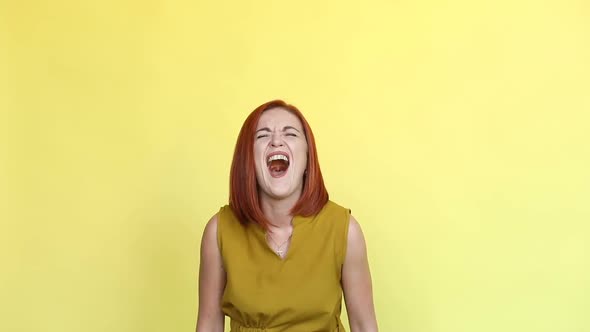 Beautiful Ginger Woman Screaming and Looking at Camera.