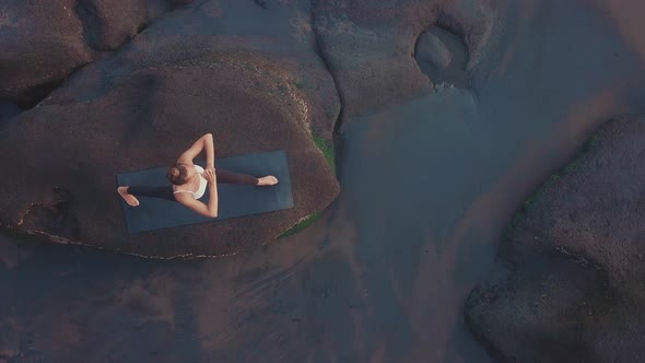 Female Yogi Practicing on Balinese Coast alt