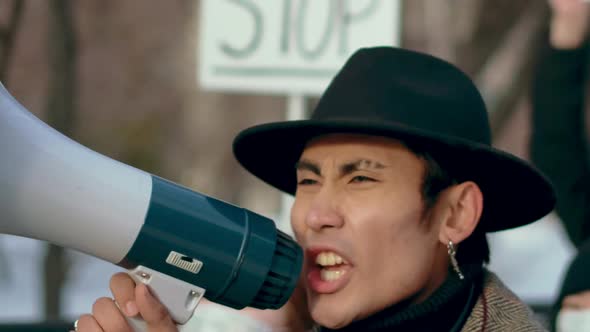 Angry Guy Walk Shout Loudspeaker Closeup. Aggressive People Strike Resistance alt