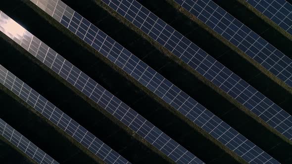 Aerial Drone Footage. Flight Over Solar Panel Farm Top Down View. Renewable Green Alternative Energy