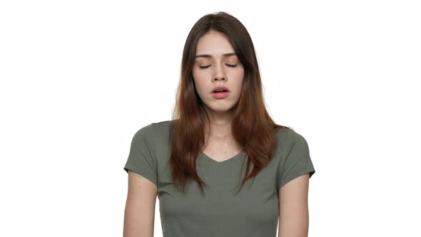 Portrait of European Woman 20s Rolling Her Eyes and Expressing Disinterest or Indifference Isolated alt