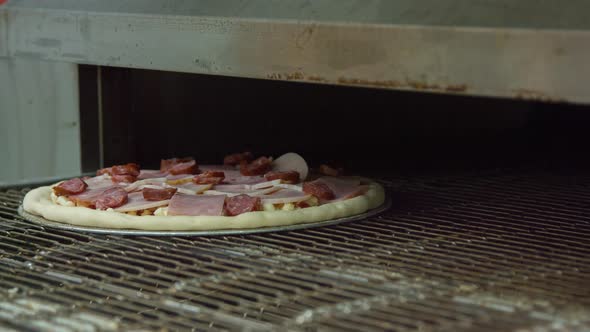 Pizza is cooked in the oven alt