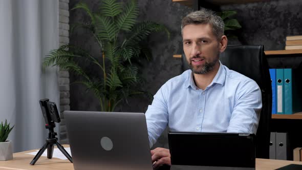 Adult Man Stock Trader Broker Distance Works for Laptop Typing Text on Keyboard alt