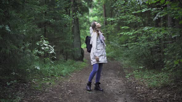 Young Woman Wondering In Wild Forest