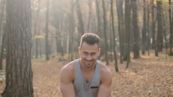 Young Man Doing Exercises In The Forest alt