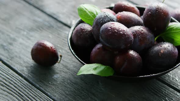 Wet Purple Plums in Bowl alt