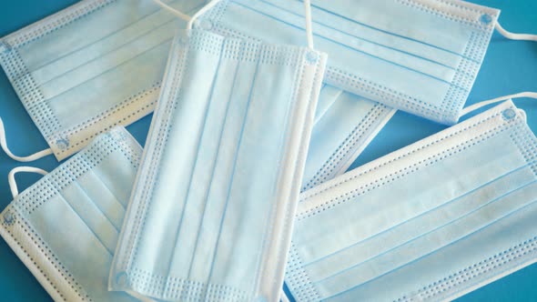 Cloth Face Masks Against Covid on Blue Table alt