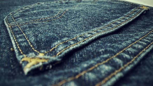 Extreme Detailed of Blue Denim Jeans Texture in Dolly Shot Over Cloth Surface alt