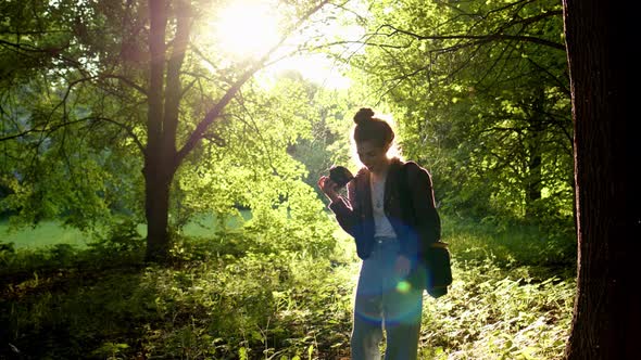 Professional Photographer Chooses Place for Photo Session in Rays of Setting Sun Which Creates alt