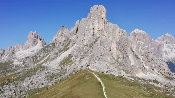 Dolomites Mountain in Italy with the Lush Green Field Surrounding the Area alt
