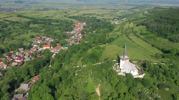 Flying Above Valeni Hungarian Reformed Church, Transylvania, Romania alt