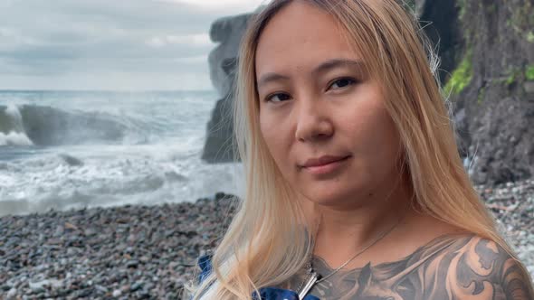 Asian Girl Face on the Background of the Sea