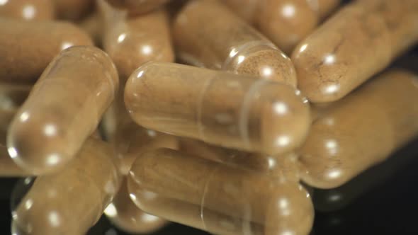 Natural medicine pills rotating close up